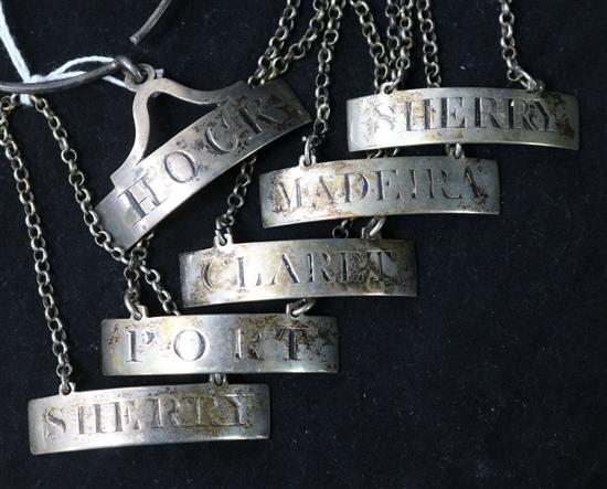 A set of six George III silver wine labels by Samuel & George Whitford, London, 1802, (five with chains, one with collar).